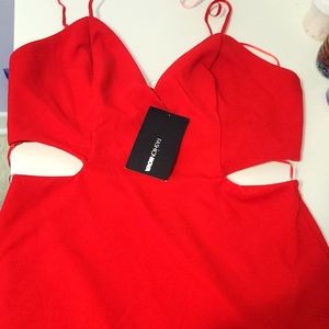 Beautiful red dress with cut outs and a large split at the side.